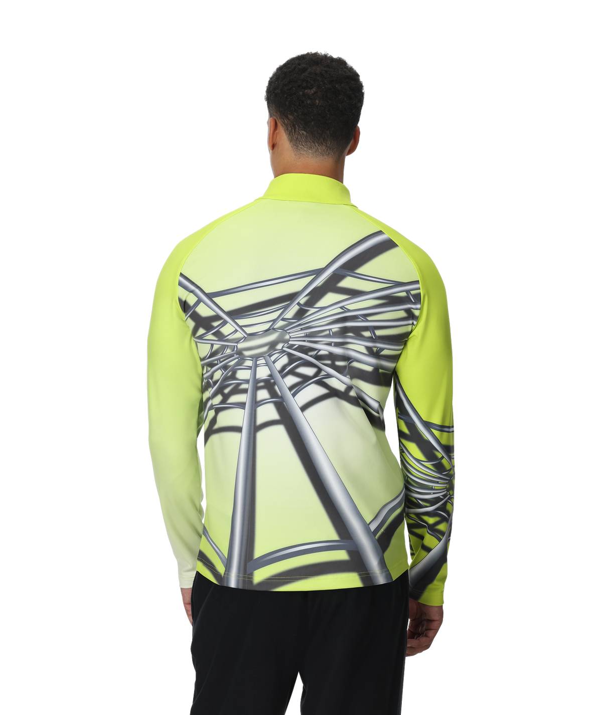 Person wearing a bright green long-sleeve shirt with a unique design on the back, standing against a white background.