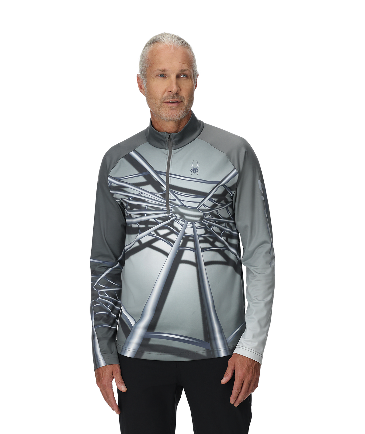 Man wearing a gray and black patterned long-sleeve shirt on a white background