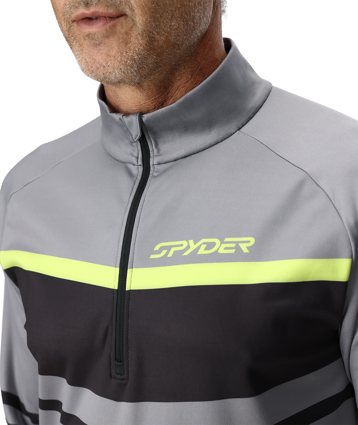 Close-up of a gray and black jacket with a yellow stripe featuring the Spyder logo.