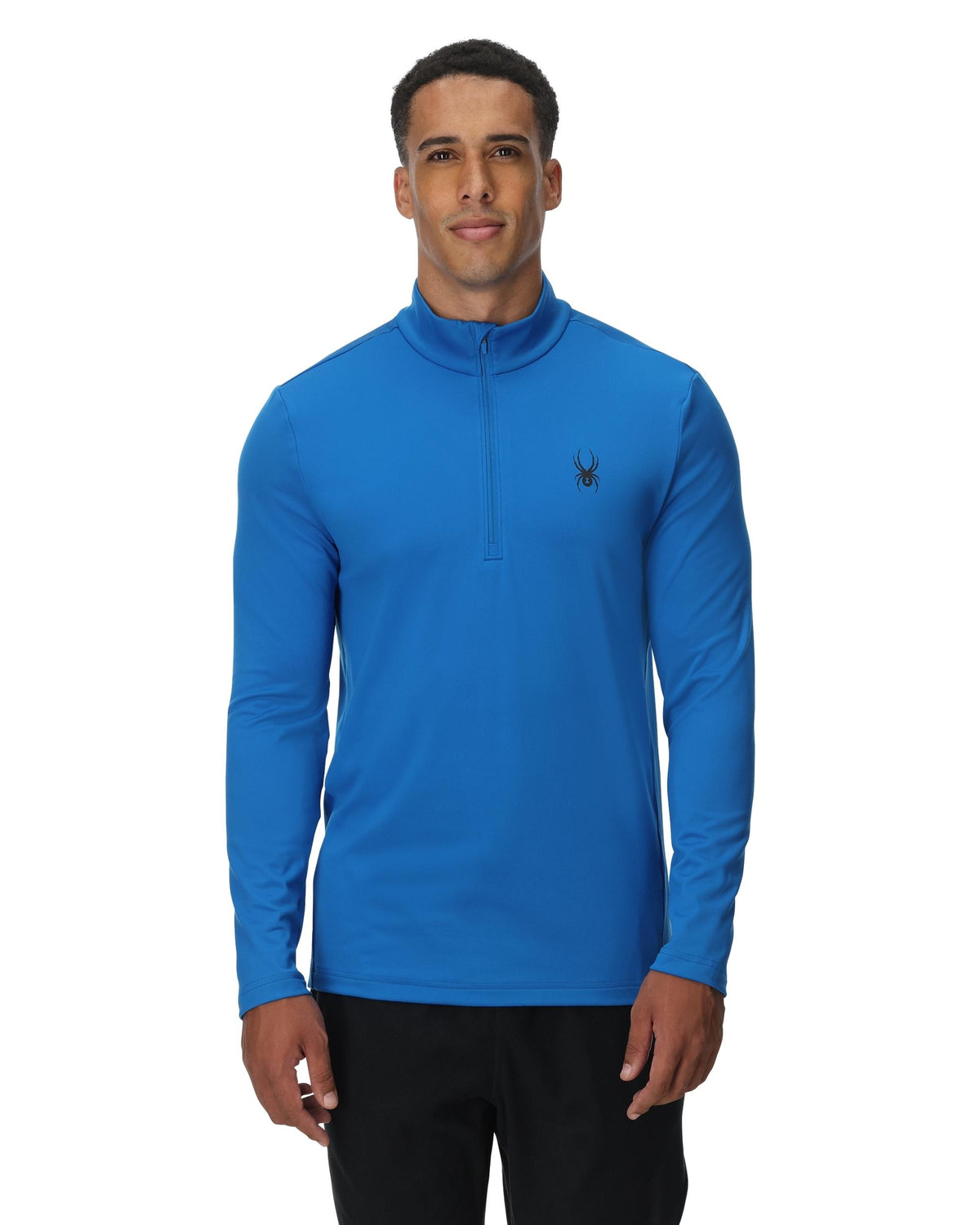 Man wearing a blue long-sleeve shirt with a brand logo on a white background