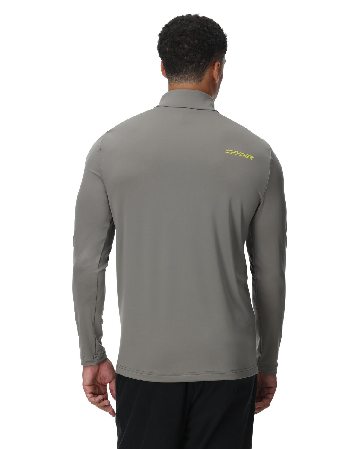 Man wearing a gray long-sleeve shirt with a brand logo on the back, on a white background