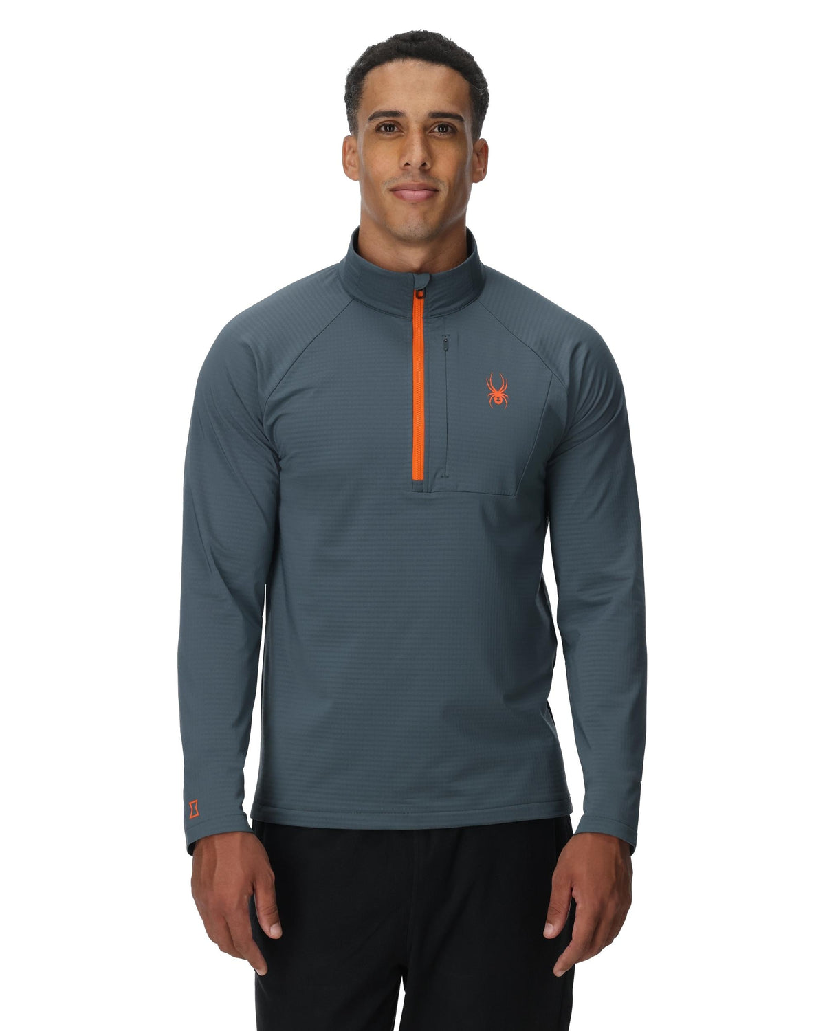 Man wearing a gray long-sleeve shirt with an orange zipper on a white background