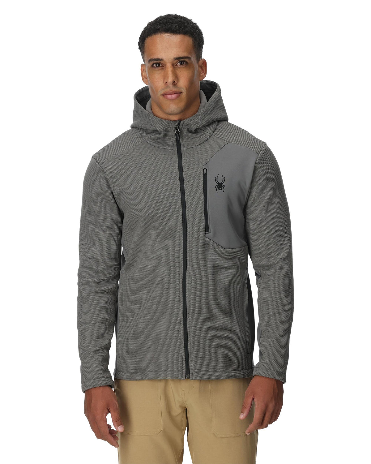 Man wearing a gray hoodie with a brand logo on a white background