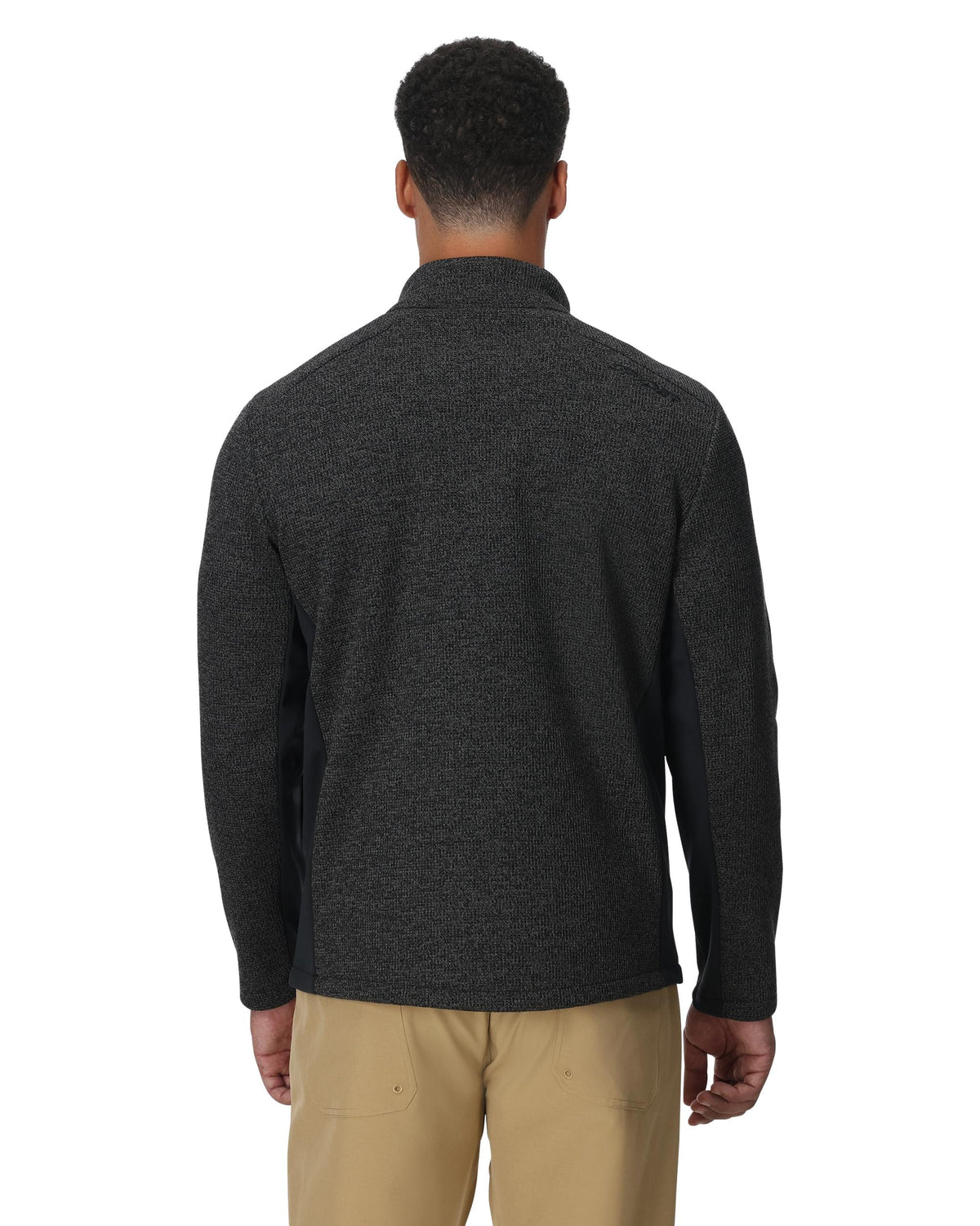 Man wearing a dark gray fleece jacket on a white background