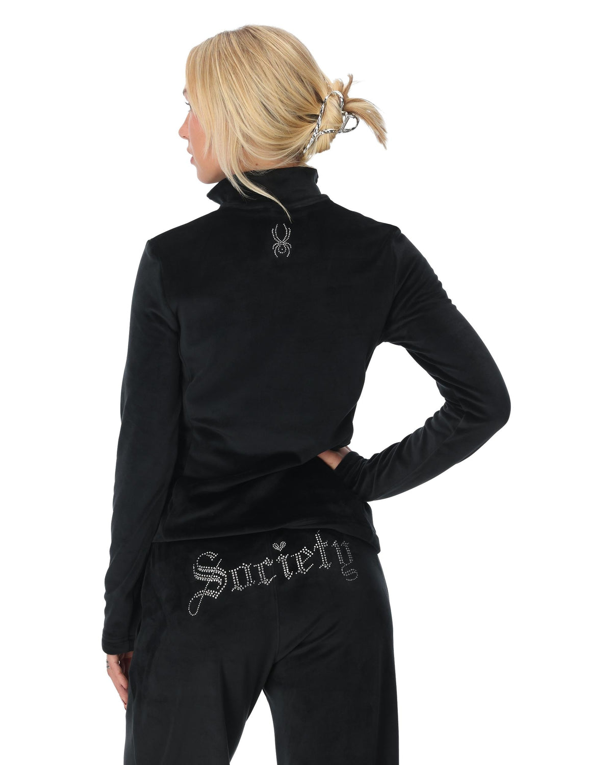 Person wearing a black turtleneck with 'Society' text on a white background