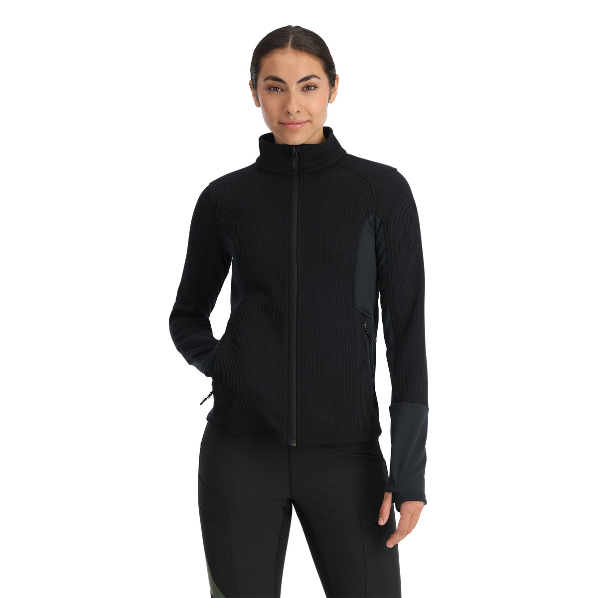 A woman wearing a black full zip Activewear sweatshirt with thumbholes, paired with black pants.