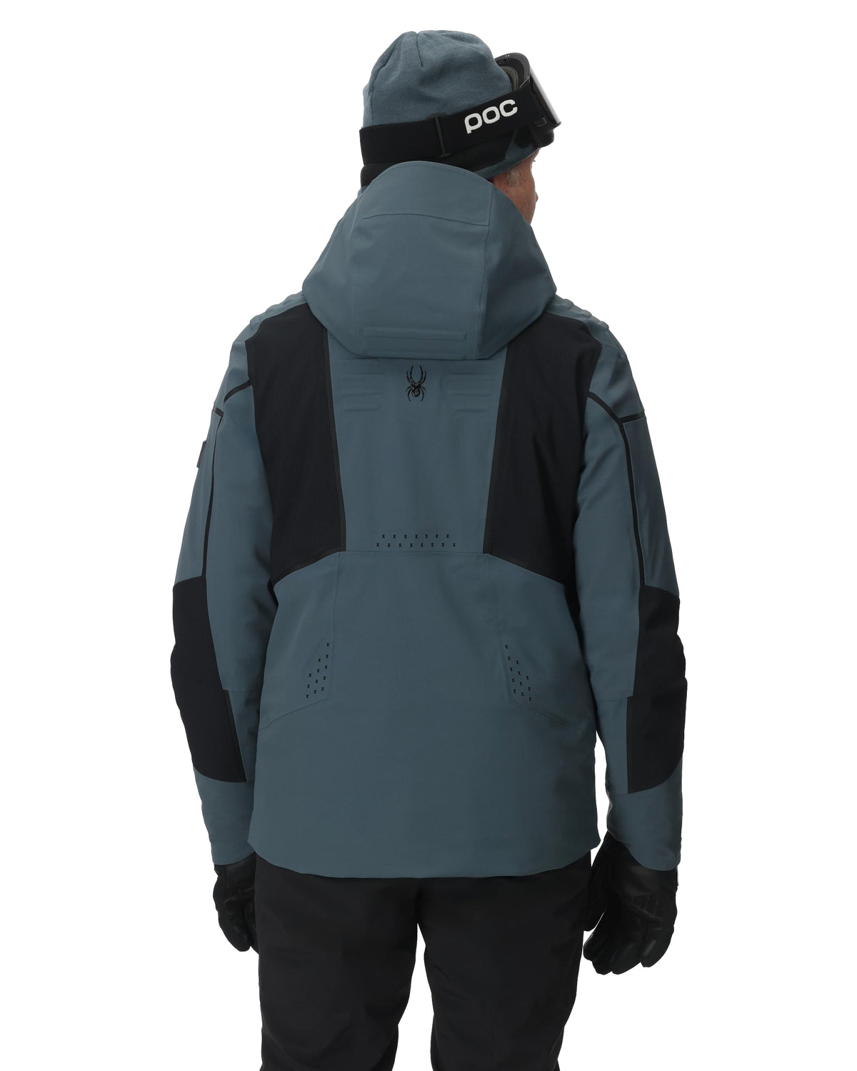 Person wearing a gray and black jacket with a hood on a white background