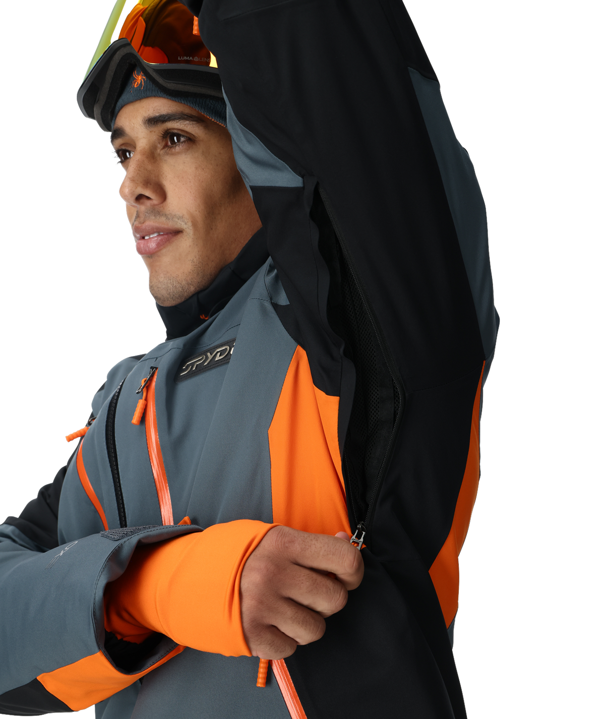 Person wearing a gray, orange, and black jacket with a brand logo on a white background