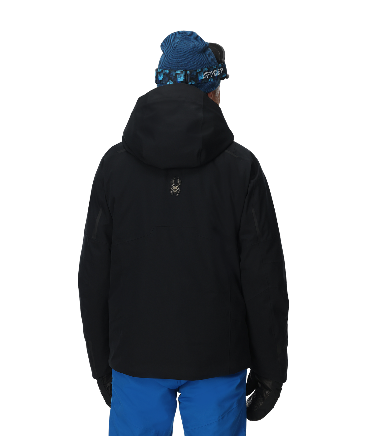 Person wearing a black jacket and blue pants with a blue beanie on a white background