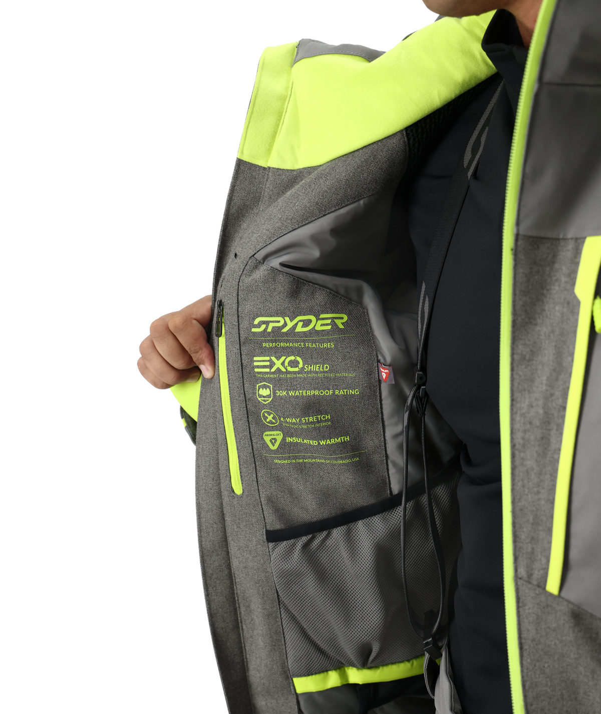 Gray and green Spyder jacket with visible branding and text on a white background