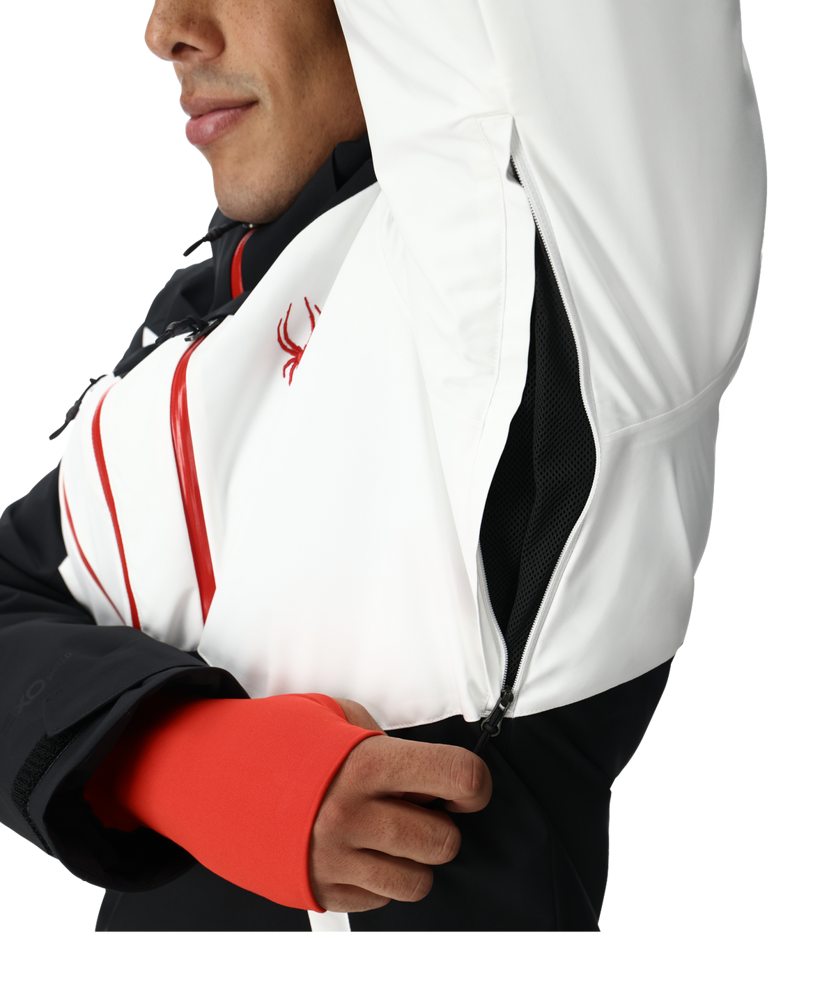 Close-up of a person wearing a white jacket with red accents and a logo.