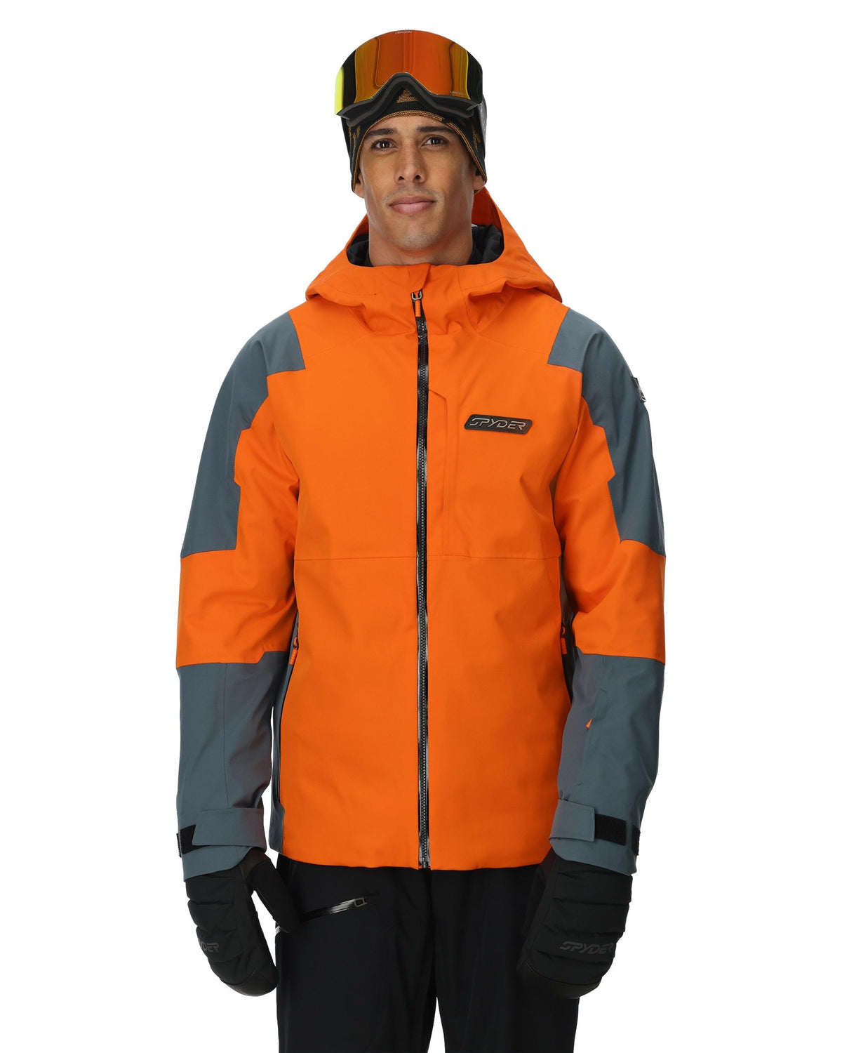 Person wearing an orange and gray jacket with a brand logo on a white background