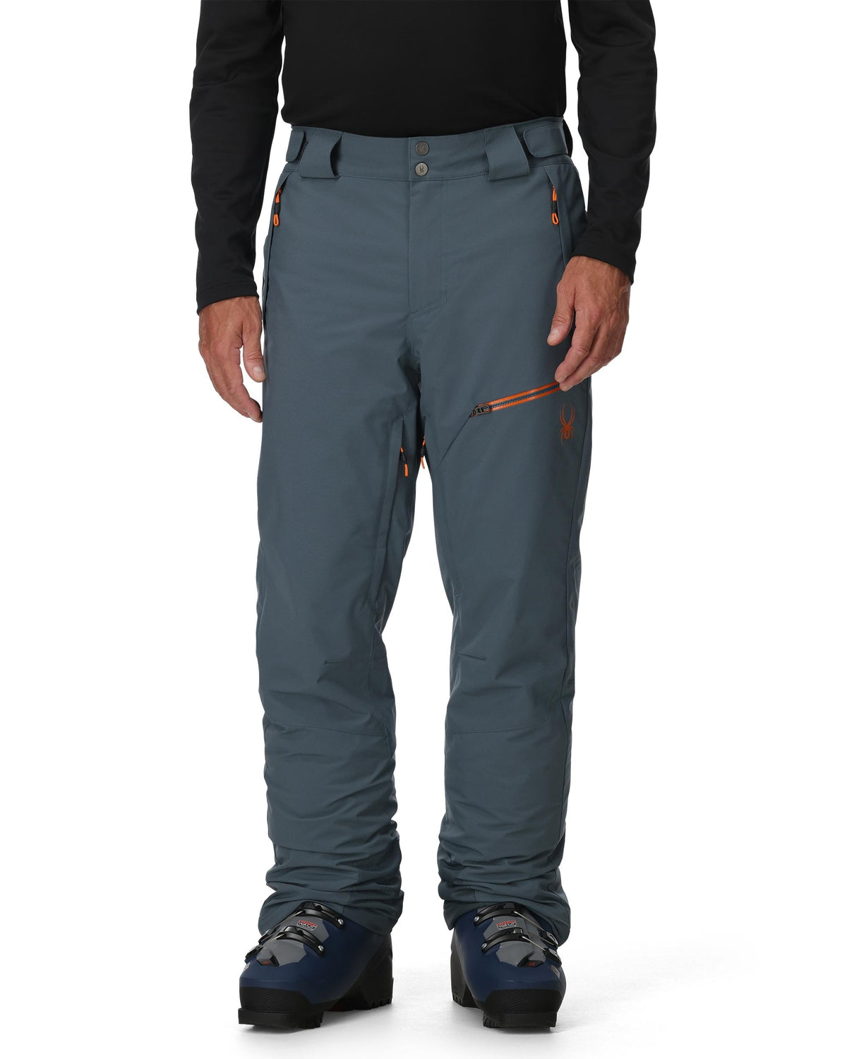 Person wearing blue pants with a black top on a white background