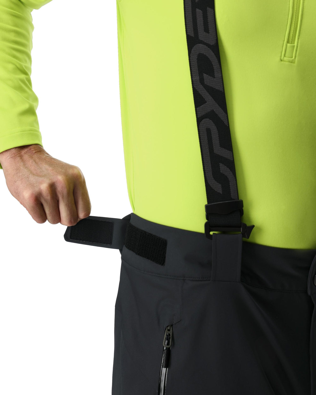 Person wearing a bright yellow jacket with a black strap and 'Cryde' branding.