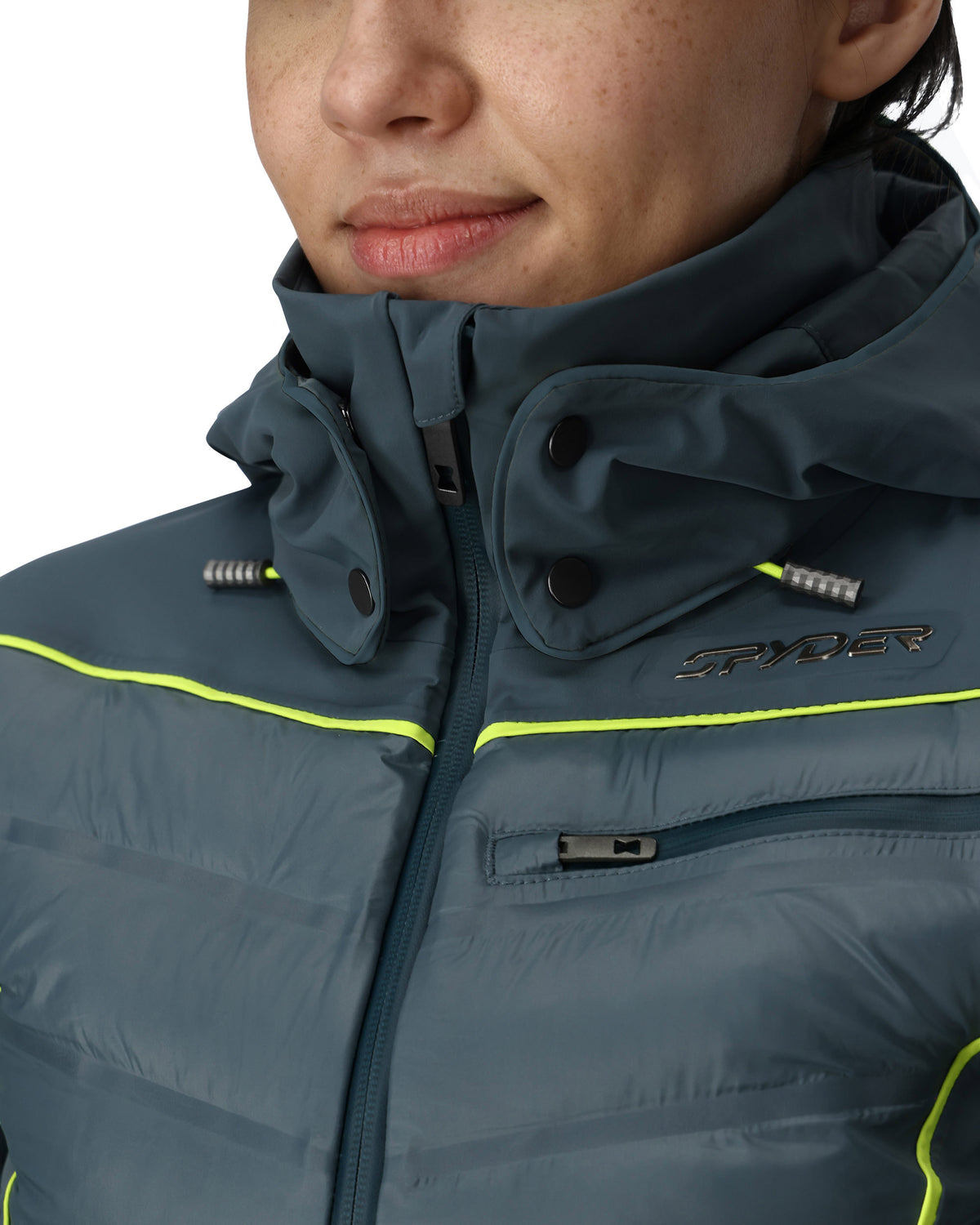 Person wearing a dark blue jacket with Spyder branding