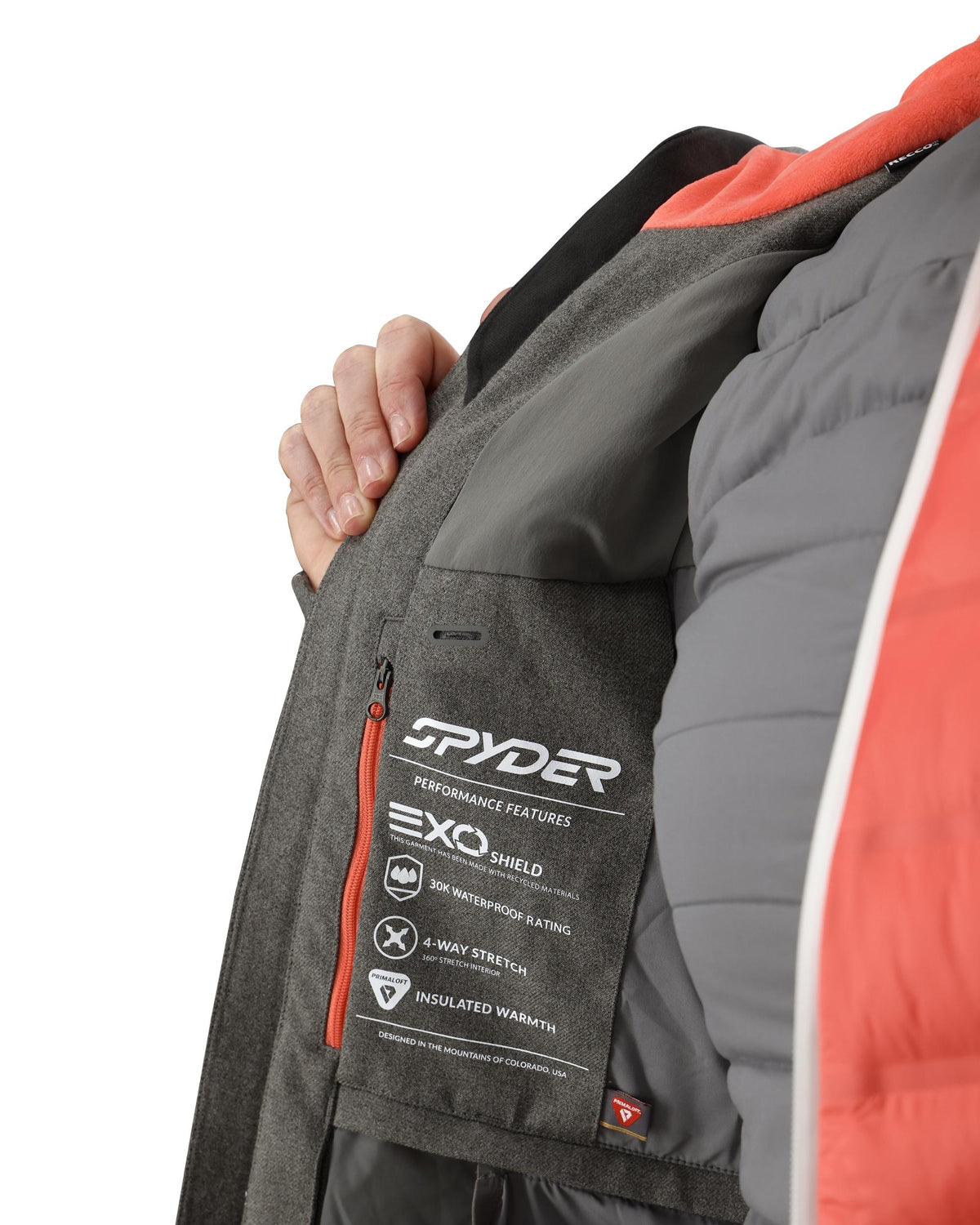 Close-up of a Spyder jacket with Exo Shield performance features on a white background