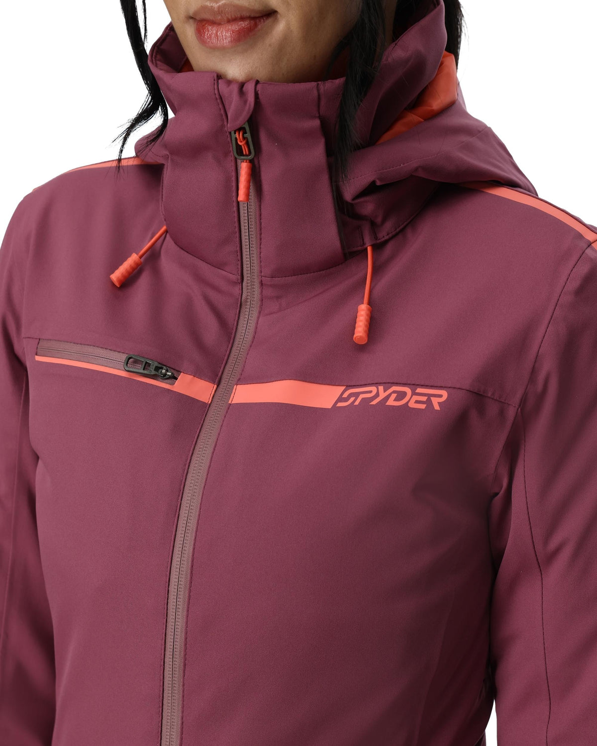 Close-up of a purple jacket with orange accents and Spyder logo.