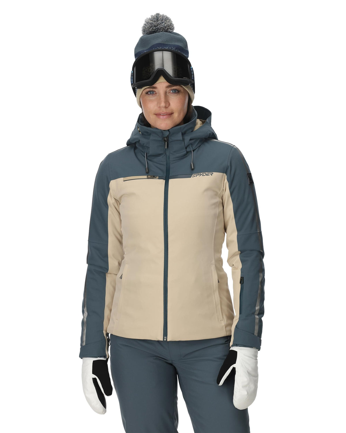 Person wearing a two-tone ski jacket with a white background