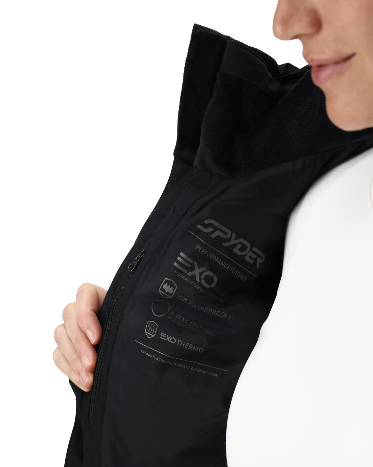 Black jacket with Spyder branding on a white background