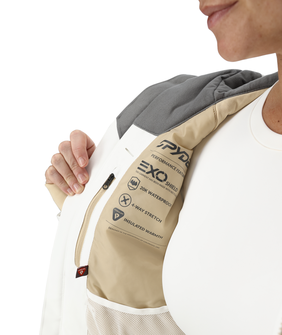 Person wearing a beige and gray EXO performance fabric sleeve on a white background