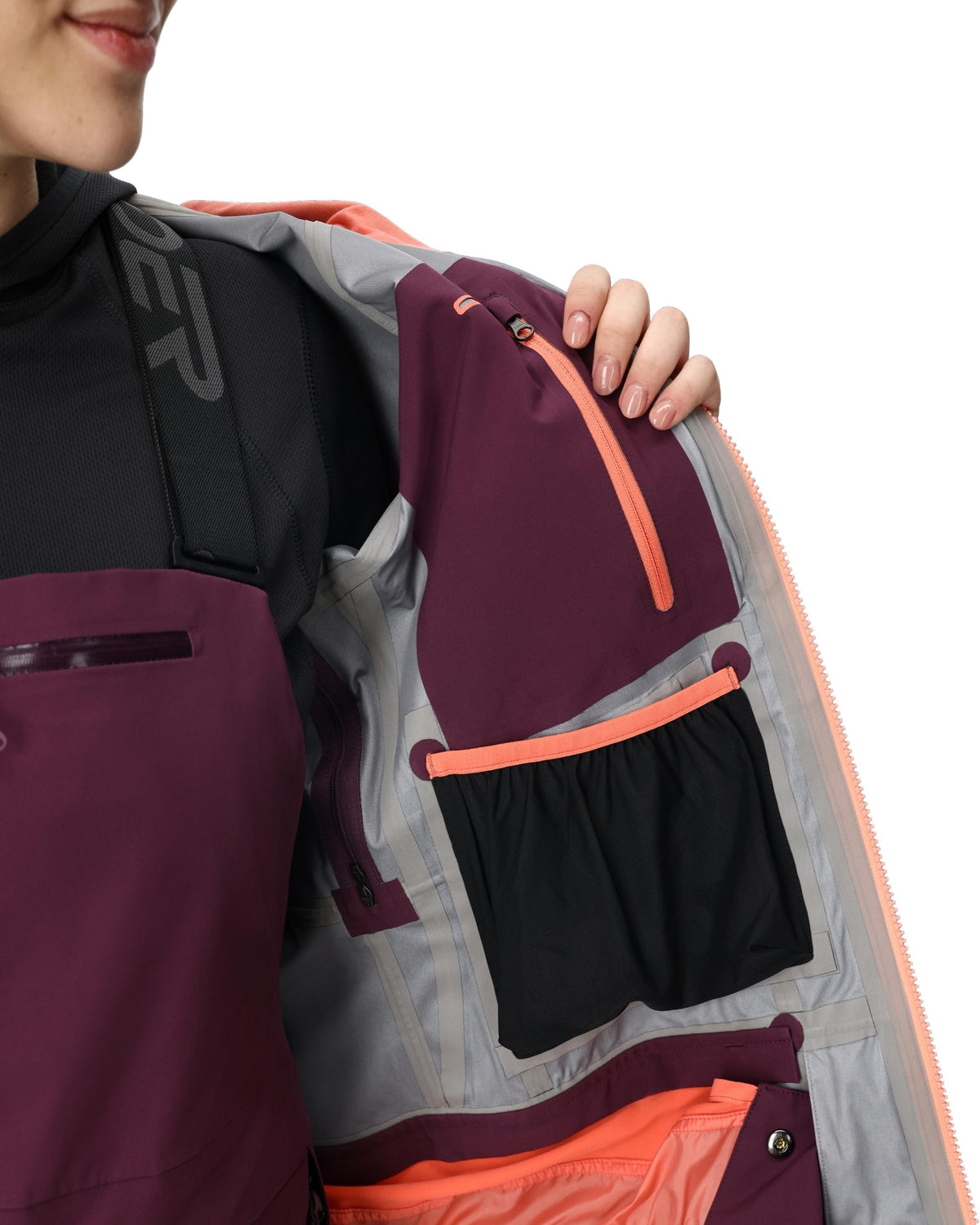 Person wearing a colorful jacket with a focus on the chest area