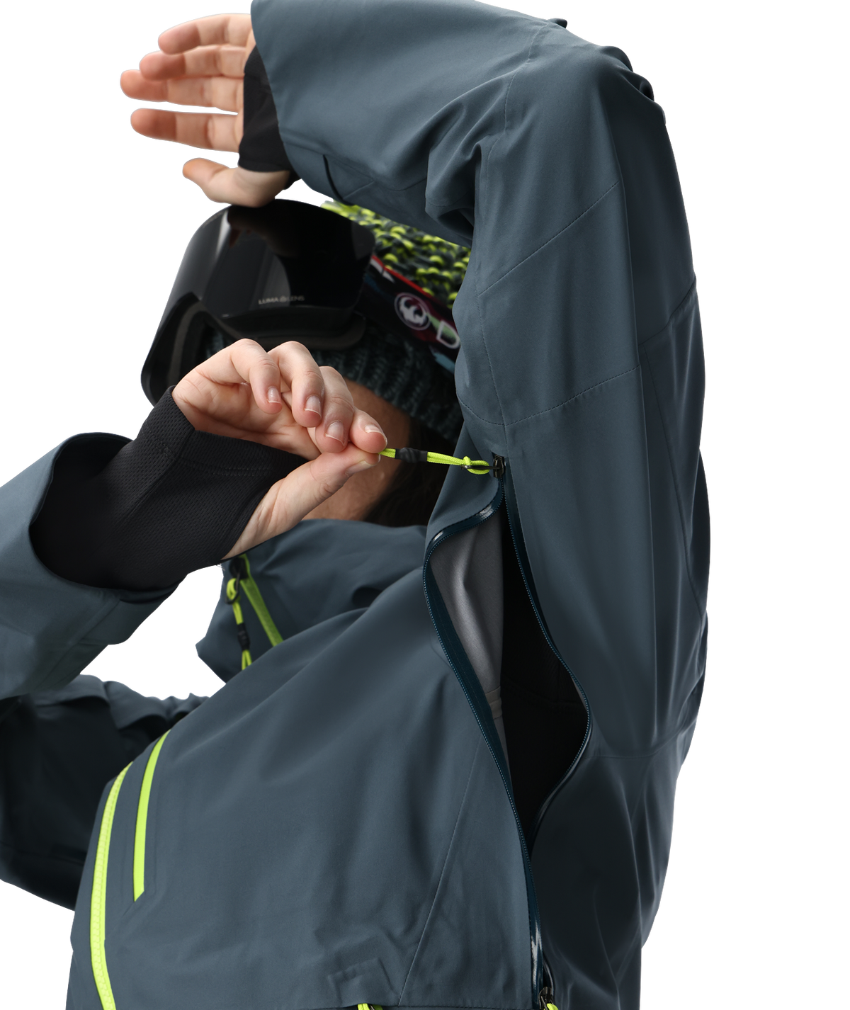 Person wearing a dark gray raincoat with yellow zippers on a white background