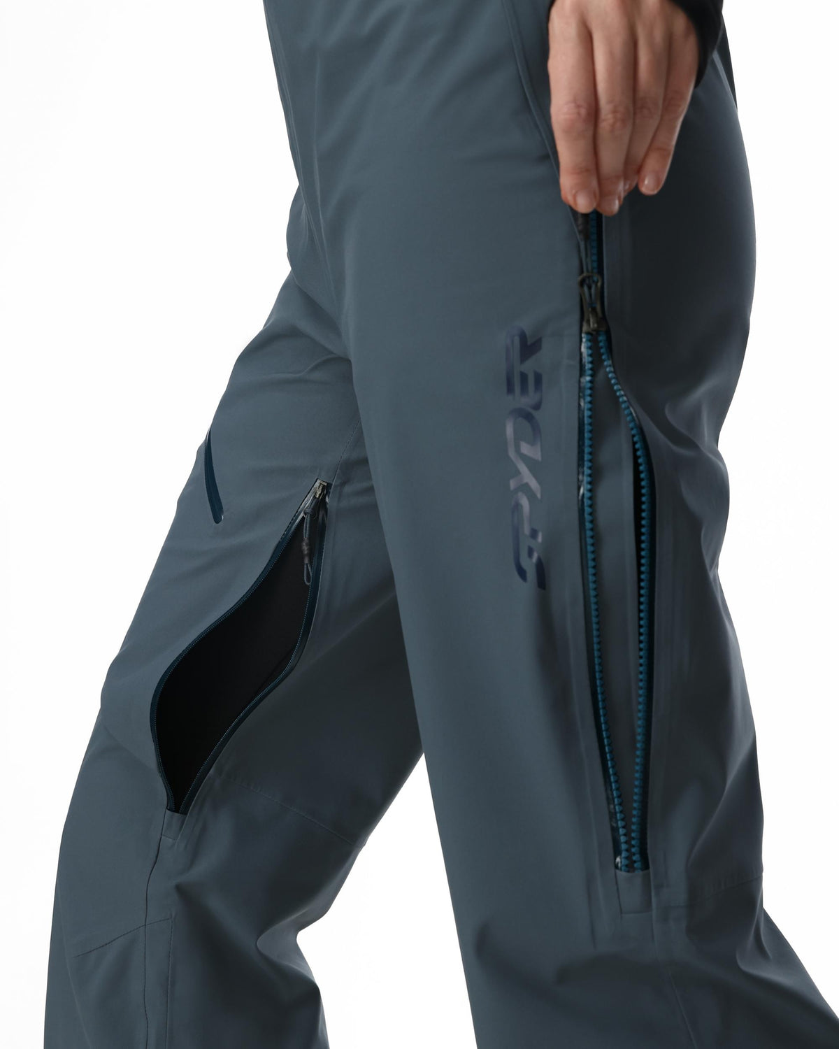 Gray pants with zippers and a brand logo on a white background