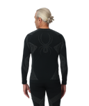 Person wearing a black compression garment with a spider logo on the back, on a white background