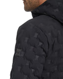 Close-up of a black quilted jacket with geometric pattern on a white background