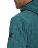 Teal quilted jacket with a brand logo on a white background