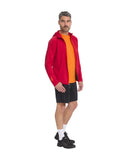 Man wearing a red jacket, orange shirt, black shorts, and black shoes on a white background