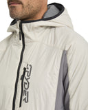 Close-up of a person wearing a white jacket with black zipper and 'Ryde' branding.
