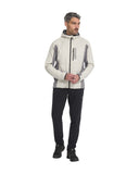Man wearing a white and gray jacket with black pants on a white background