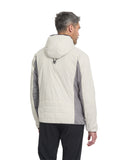 Man wearing a two-tone jacket with a hood on a white background