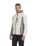 Man wearing a white and gray jacket with a brand logo on a white background
