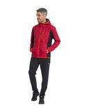Man wearing a red and black jacket with orange accents on a white background