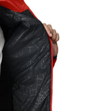 Close-up of a black jacket with red zipper on a white background