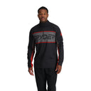 A man wearing a black Spyder half zip t-neck sweater with color blocking and a visible Spyder wordmark.