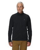 Man wearing a black jacket with a logo on a white background