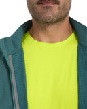 Person wearing a green jacket over a bright yellow shirt