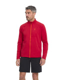 Man wearing a red jacket with a zipper and black shorts on a white background