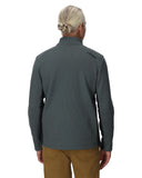 Person wearing a gray pullover with a brand logo on the back, standing against a white background