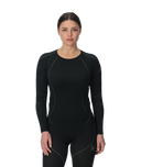 Woman wearing a black long-sleeve athletic outfit on a white background