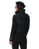 Person wearing a black jacket and pants on a white background