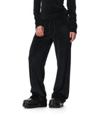 Person wearing black pants on a white background