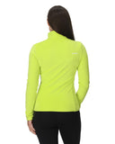 Person wearing a bright green jacket on a white background
