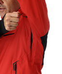 Person wearing a red and black jacket with a close-up of the hood.
