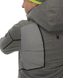 Person wearing a gray jacket with a Spyder logo, showing extra stretch in the shoulder area.