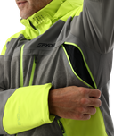 Close-up of a person wearing a gray and neon yellow Spyder jacket.