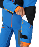 Blue and black winter jacket with orange accents on a white background